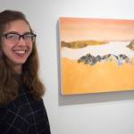 Crystal Cudworth stands with her oil painting Wasterock is the Reason for Juneau on display at the Juneau-Douglas City Museum in February 2019. She will be part of this weeks First Friday festivities. (Michael Penn | Juneau Empire File)