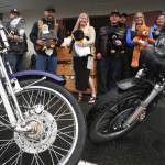 Members of the Panhandlers Motorcycle Club of Alaska pose with staff at Bartlett Regional Hospital on Tuesday, Sept. 3, 2019, with toys collected during the 25th Annual Toy Run for young patients and visitors to the hospital. (Michael Penn | Juneau Empire)