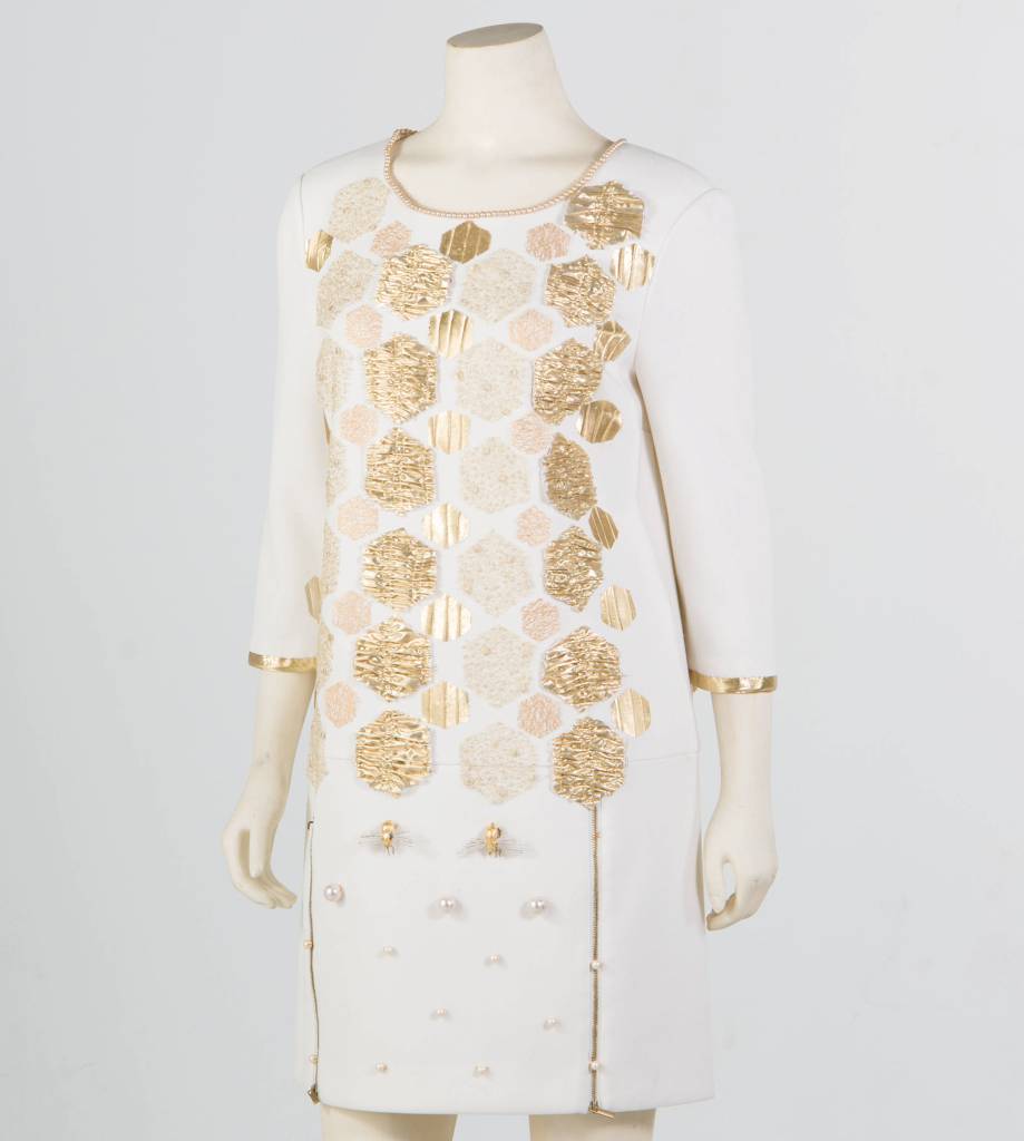 A dress made by Shea Zahedi that will soon be show in New York City incorporates handmade lamé bees and hexagons. Like much of Zahedis new First Impressions collection, it was inspired by art. (Courtesy Photo | Erica J. Mitchell)