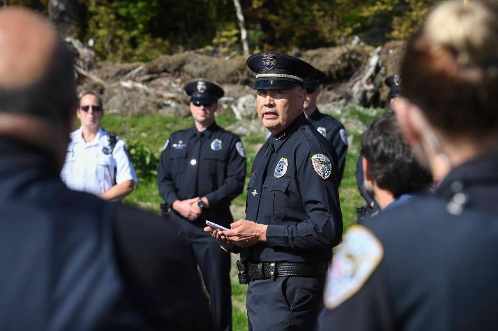 Juneau Police Department Chief Ed Mercer and his officers attend a ribbon-cutting ceremony on Karl Reishus Boulevard to commemorate the near completion of the Pederson Hill Subdivision on Friday, Sept. 6, 2019. Reishus was a Juneau Police Department officer who died in 1992 when he fell from a 40-foot tower during a training exercise. (Michael Penn | Juneau Empire)