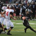 Juneaus Ali Beya, right, runs against Wasillas Colton Lindquist in the first quarter at Adair-Kennedy Memorial Field on Friday, Sept. 6, 2019. Juneau won 63-0. (Michael Penn | Juneau Empire)