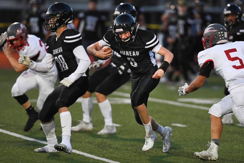 Juneaus Noah Chambers follows a block by teammate Danny Isaak against Wasilla in the second quarter at Adair-Kennedy Memorial Field on Friday, Sept. 6, 2019. Juneau won 63-0. (Michael Penn | Juneau Empire)