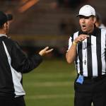 Juneaus head coach Rich Sjoroos exchanges words with referee Bob Simms as Juneau plays against Wasilla at Adair-Kennedy Memorial Field on Friday, Sept. 6, 2019. Juneau won 63-0. (Michael Penn | Juneau Empire)