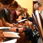 Students take notes during Dan Grossmans lecture at the Juneau Arts and Humanities Council on Monday, Sept. 9, 2019. (Peter Segall | Juneau Empire)