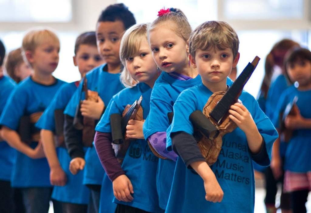 In this November 2013 photo, kindergartners give looks of anticipation before their first Kindergarten Paper Violin Concert at Glacier Valley Elementery School Wednesday. This is JAMMs 10th anniversary and they will have a cruise Saturday. (Michael Penn | Juneau Empire File)