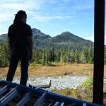 General Manager Dave Scanlan takes in the view from the front deck of the nearly complete Hilda Dam Cabin at Eaglecrest Ski Area on Monday, Sept. 9, 2019. The first city-owned cabin, that can sleep eight, will be open for rental in mid-October according to Scanlan. (Michael Penn | Juneau Empire)