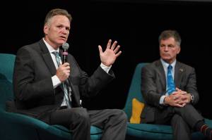 Alaska Gov. Mike Dunleavy and Wyoming Gov. Mark Gordon speak during the International Forum of Sovereign Wealth Funds annual meeting Thursday, Sept. 12, 2019, at Centennial Hall. The two governors were part of a panel discussion during the yearly gathering of state-owned investment funds. (Michael Penn | Juneau Empire)