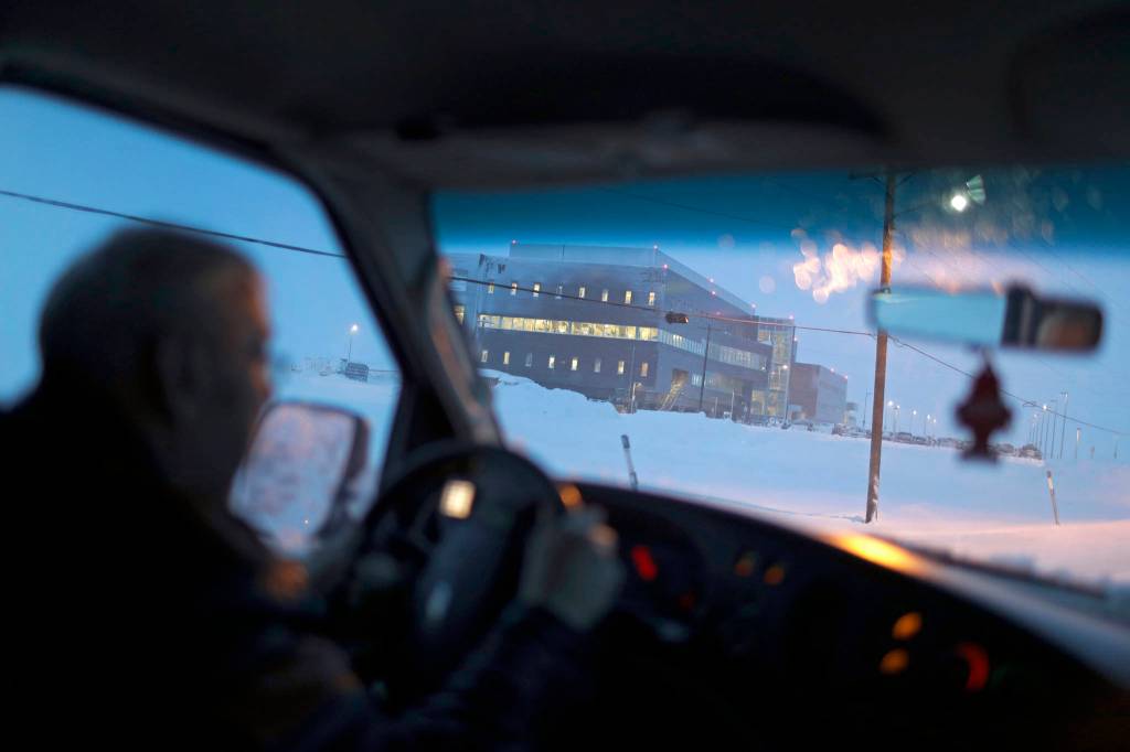 In this Feb. 21 photo, the Norton Sound Regional Hospital is seen through a taxi windshield during a storm in Nome. The main hospital serving residents in the Bering Strait region is located about a mile from downtown Nome. (AP Photo | Wong Maye-E)