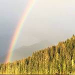 A rainbow over Auke Lake, just ahead of Katherine Hayhoes talk, Christianity and Climate Change, at Chapel by the Lake on Sept. 13, 2019. (Peter Segall | Juneau Empire )