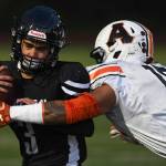 Juneaus Gaby Soto is tackled by Wests Dhar Montalbo in the first quarter at Adair-Kennedy Memorial Field on Friday, Sept. 13, 2019. West won 43-14. (Michael Penn | Juneau Empire)