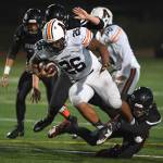 Juneaus Dawson Hickok tackles Wests Elias Roehl-Paredes in the second quarter at Adair-Kennedy Memorial Field on Friday, Sept. 13, 2019. West won 43-14. (Michael Penn | Juneau Empire)