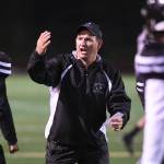 Juneaus coach Rich Sjoroos speaks to his players as they play against West at Adair-Kennedy Memorial Field on Friday, Sept. 13, 2019. West won 43-14. (Michael Penn | Juneau Empire)