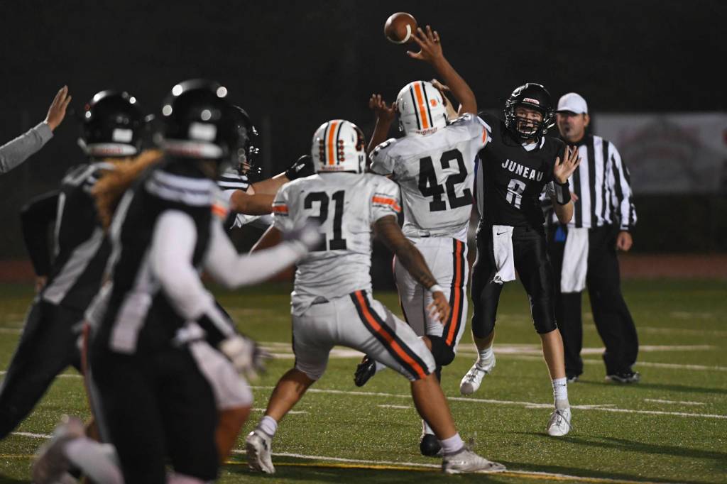 Juneaus quarterback Noah Chambers passes against West in the second quarter at Adair-Kennedy Memorial Field on Friday, Sept. 13, 2019. West won 43-14. (Michael Penn | Juneau Empire)