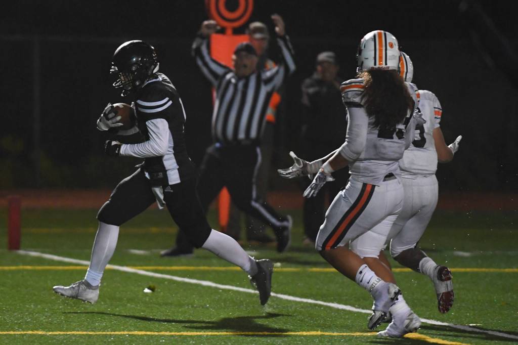 Juneaus Cooper Kriegmont scores in the second quarter against West at Adair-Kennedy Memorial Field on Friday, Sept. 13, 2019. West won 43-14. (Michael Penn | Juneau Empire)
