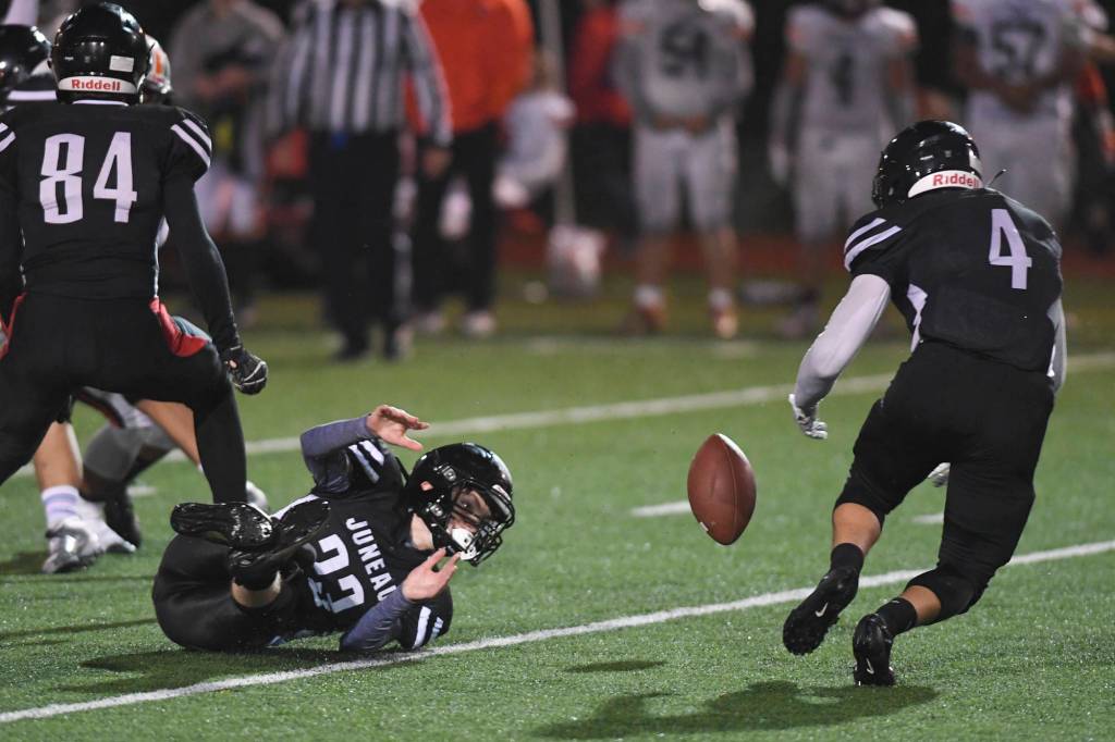 Juneaus Ali Beya, right, recovers a fumble by teammate James Connally in the third quarter against West at Adair-Kennedy Memorial Field on Friday, Sept. 13, 2019. West won 43-14. (Michael Penn | Juneau Empire)