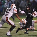 Juneaus Ali Beya, right, runs against Wests Romeo Vaimili in the third quarter at Adair-Kennedy Memorial Field on Friday, Sept. 13, 2019. West won 43-14. (Michael Penn | Juneau Empire)