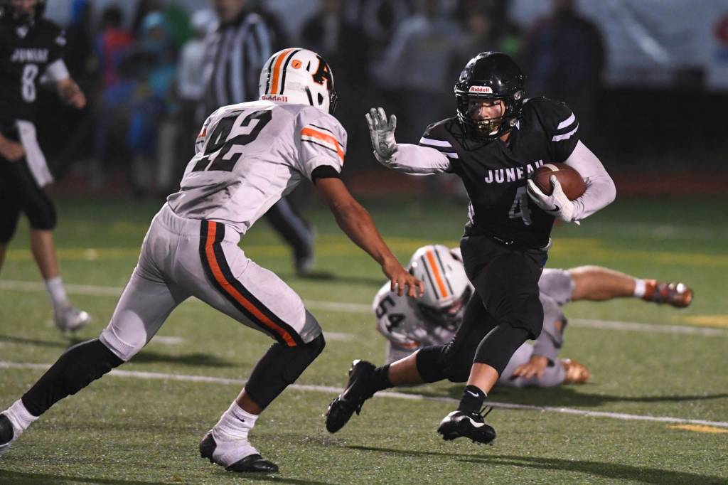 Juneaus Ali Beya, right, runs against Wests Romeo Vaimili in the third quarter at Adair-Kennedy Memorial Field on Friday, Sept. 13, 2019. West won 43-14. (Michael Penn | Juneau Empire)