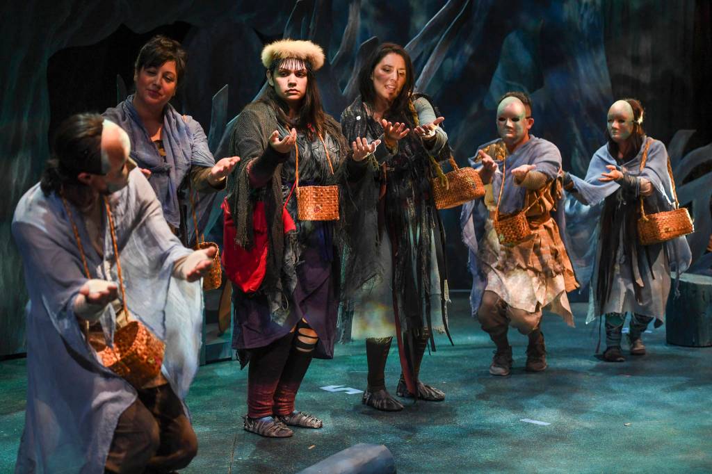Erin Tripp, center, playing Aanteinatu, is welcomed into a new clan during the Perseverance Theatres production of Devilfish written by Vera Starbard on Tuesday, Sept. 17, 2019. (Michael Penn | Juneau Empire)