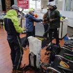 Juneau Mountain Rescue personnel gather at the Mount Roberts Tramway to find a lost person on Mount Roberts on Friday, Sept. 20, 2019. (Michael Penn | Juneau Empire)
