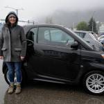 Nikki Hogan poses with her 2014 Electric Smart Car as Juneau residents meet for the Sixth Annual Electric Vehicle Juneau Roundup on Saturday, Sept. 21, 2019. (Michael Penn | Juneau Empire)