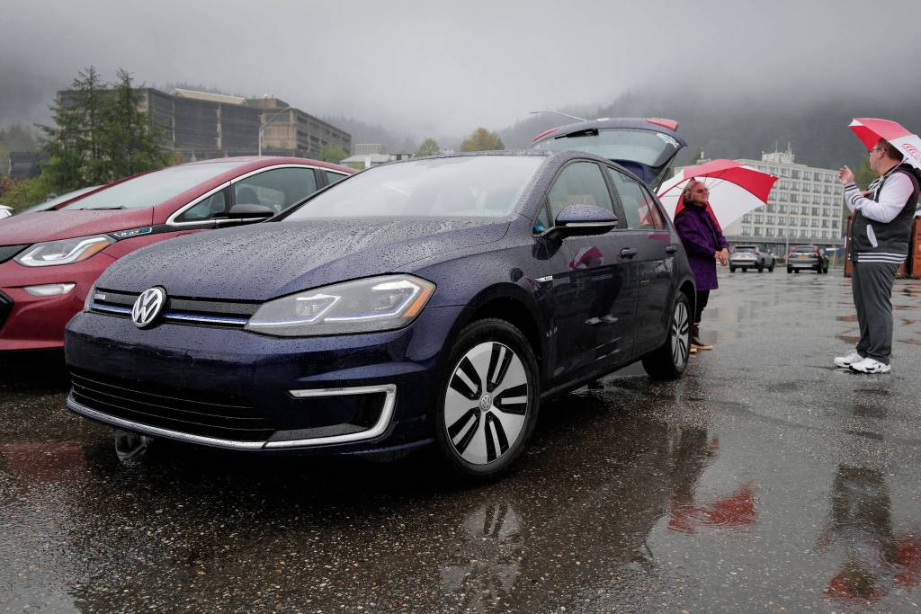 Nancy Waterman talks about her electric Volkswagen vehicle as Juneau residents meet for the Sixth Annual Electric Vehicle Juneau Roundup on Saturday, Sept. 21, 2019. (Michael Penn | Juneau Empire)