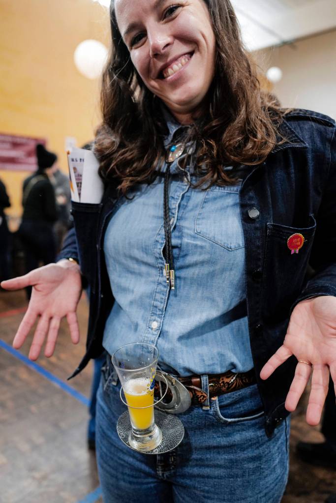 Shannon Fisher came prepared with her belt-buckle glass holder at the Rotary Club of Juneaus Eighth Annual Capital Brewfest at the Juneau Arts and Culture Center on Saturday, Sept. 21, 2019. Twenty brewing and distribution companies were on hand for the fundraiser to benefit the University of Alaska and Rotarys service projects, scholarships, international youth exchanges and other project. The event was sold out with 900 tickets sold. (Michael Penn | Juneau Empire)