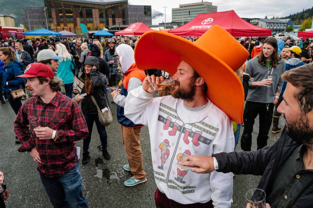 Chris Hinkley came prepared with a hat enough to protect him from the rain at the Rotary Club of Juneaus 8th Annual Capital Brewfest at the Juneau Arts and Culture Center on Saturday, Sept. 21, 2019. Twenty brewing and distribution companies were on hand for the fundraiser to benefit the University of Alaska and Rotarys service projects, scholarships, international youth exchanges and other project. The event was sold out with 900 tickets sold. (Michael Penn | Juneau Empire)