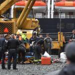 Juneau Police Department officers and Capital City Fire/Rescue personnel respond to an accident at the Downtown Public Library on Monday, Sept. 23, 2019. A construction worker was injured at a work site after a driver reportedly drove through the library parking barrier. (Michael Penn | Juneau Empire)