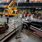 Juneau Police Department officers and Capital City Fire/Rescue personnel respond to an accident at the Downtown Public Library on Monday, Sept. 23, 2019. A construction worker was injured at a work site after a driver reportedly drove through the library parking barrier. (Michael Penn | Juneau Empire)
