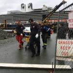 Capital City Fire/Rescue EMTs transport an injured person to an ambulance downtown near the cruise ship docks on Monday, Sept. 23, 2019. (Michael S. Lockett | Juneau Empire)