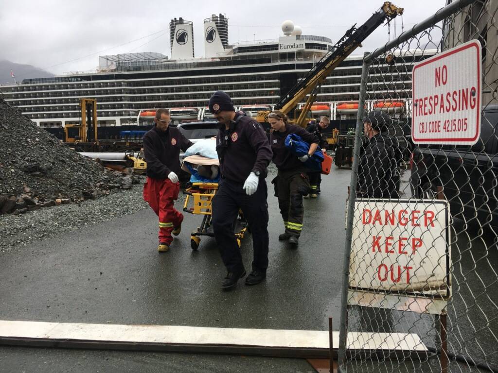 Capital City Fire/Rescue EMTs transport an injured person to an ambulance downtown near the cruise ship docks on Monday, Sept. 23, 2019. (Michael S. Lockett | Juneau Empire)