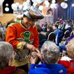 Michael Tagaban, of the Wooshkeetaan Clan, brings water to elders during a Warming of the Hands ceremony at the Juneau Arts & Culture Center in November 2013. The ceremony opened a four-day Sharing Our Knowledge conference at Centennial Hall focusing on culture and Tlingit language. The conference starts Thursday and runs through Sunday this year. (Michael Penn | Juneau Empire File)