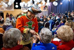 Michael Tagaban, of the Wooshkeetaan Clan, brings water to elders during a Warming of the Hands ceremony at the Juneau Arts & Culture Center in November 2013. The ceremony opened a four-day Sharing Our Knowledge conference at Centennial Hall focusing on culture and Tlingit language. The conference starts Thursday and runs through Sunday this year. (Michael Penn | Juneau Empire File)