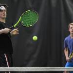 William Smoker, left, volleys in front of his partner, Will Rehfeldt as they play against Luke Bibb and Reed Loree at the Region V Tennis Tournament at The Alaska Club/JRC on Wednesday, Sept. 25, 2019. Smoker and Rehfeldt won the match 6-0, 6-0, and will play Liam Penn and Callan Smith in the final on Saturday. (Michael Penn | Juneau Empire)