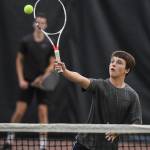 Alain Soltys-Gray returns a volley as he plays doubles with partner Kevin Kooistra as they play against Liam Penn and Callan Smith at the Region V Tennis Tournament at The Alaska Club/JRC on Wednesday, Sept. 25, 2019. Penn and Smith won the match 6-2, 6-1, and will play Will Rehfeldt and William Smoker in the final on Saturday. (Michael Penn | Juneau Empire)