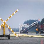 A flashing X signals the closed runway as crews work on a repaving project at the Juneau International Airport in 2015. (Michael Penn | Juneau Empire)