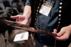 Steve Henrikson, Curator of Collections at the Alaska State Museum, displays a plastic replica of a Tlingit throwing stick before his presentation on spear throwing with Richard VanderHoek, State Archaeologist with the Alaska Department of Natural Resources Office of History and Archaeology, as part of the Sharing Our Knowledge conference on Friday, Sept. 27, 2019. (Michael Penn | Juneau Empire)