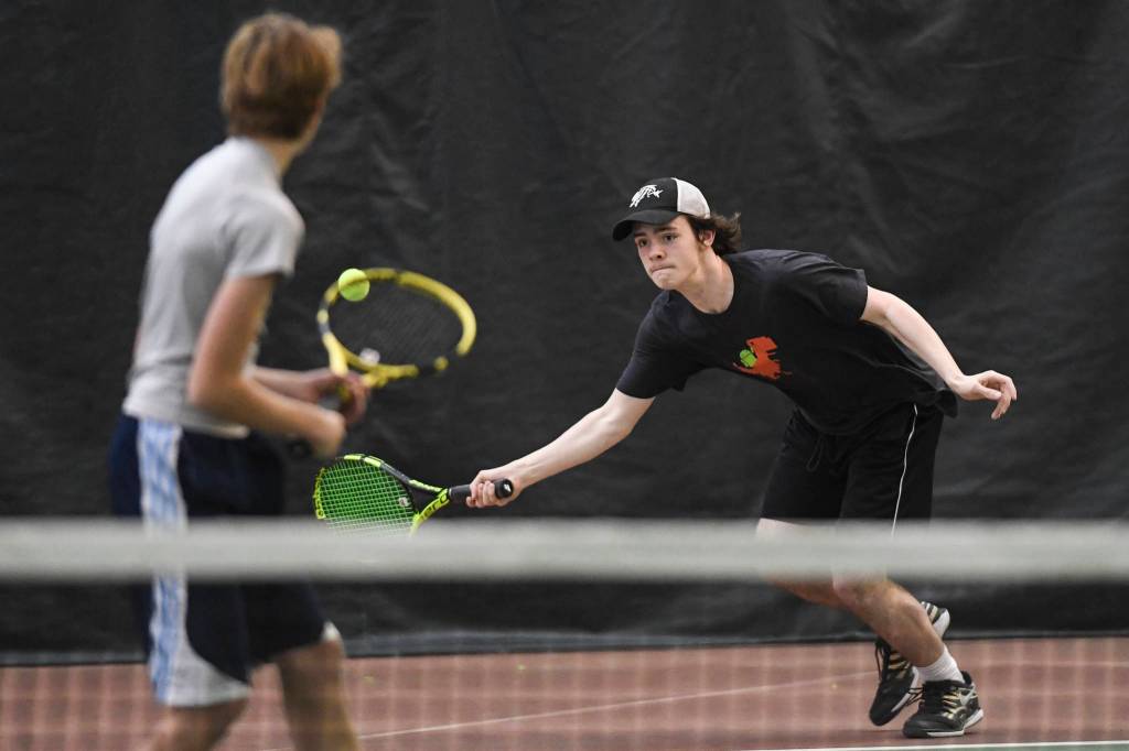 William Smoker, right, returns a forehand in a boys doubles semifinal with partner Will Rehfeldt against Liam Penn and Callan Smith during the Region V Tennis Tournament at The Alaska Club/JRC on Saturday, Sept. 28, 2019. Smoker/Rehfeldt won 7-6, 6-2. (Michael Penn | Juneau Empire)