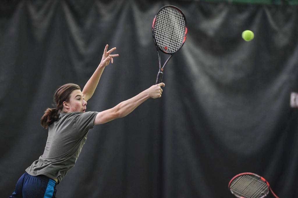 Liam Penn returns a volley as he plays in a boys doubles semifinal with partner Callan Smith against William Smoker and Will Rehfeldt during the Region V Tennis Tournament at The Alaska Club/JRC on Saturday, Sept. 28, 2019. Smoker/Rehfeldt won 7-6, 6-2. (Michael Penn | Juneau Empire)