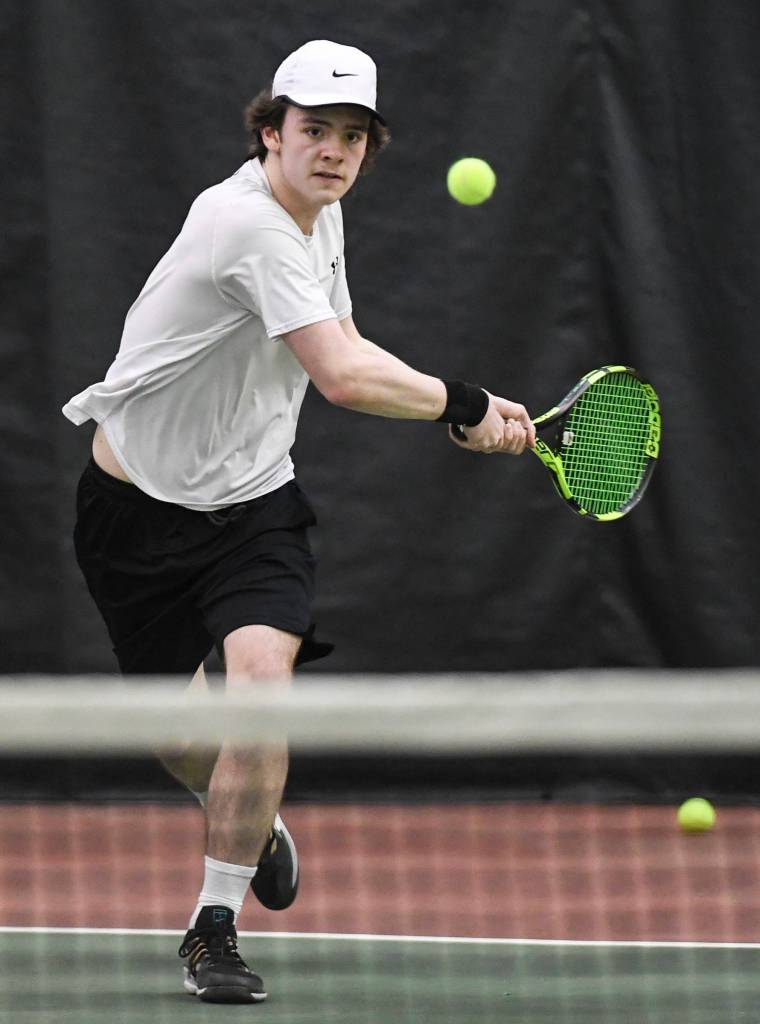William Smoker returns a backhand against Kevin Kooistra in the boys singles final during the Region V Tennis Tournament at The Alaska Club/JRC on Sunday, Sept. 29, 2019. Kooistra won 6-0, 6-0. (Michael Penn | Juneau Empire)