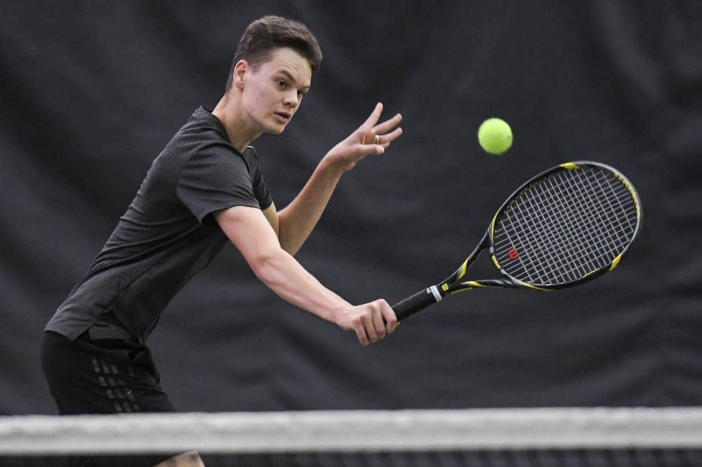 Kevin Kooistra returns a volley against William Smoker in the boys singles final during the Region V Tennis Tournament at The Alaska Club/JRC on Sunday, Sept. 29, 2019. Kooistra won 6-0, 6-0. (Michael Penn | Juneau Empire)