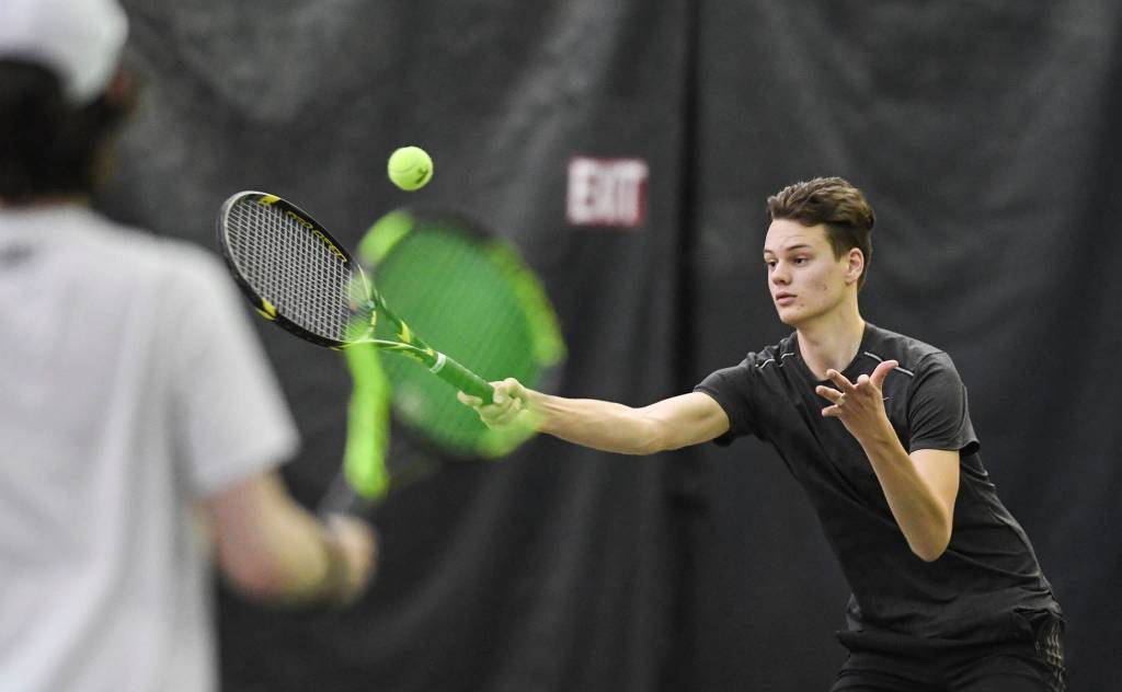 Kevin Kooistra returns a volley during the mixed doubles final with partner Anna Dale against Olivia Moore and William Smoker during the Region V Tennis Tournament at The Alaska Club/JRC on Sunday, Sept. 29, 2019. Dale/Kooistra won 6-0, 6-2. (Michael Penn | Juneau Empire)