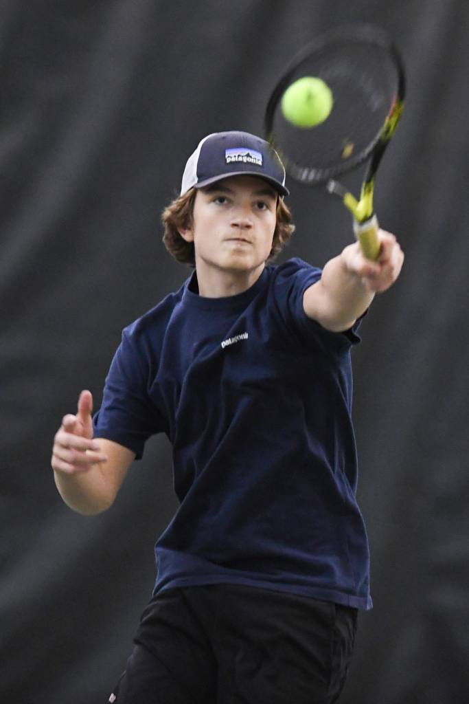 Reed Loree hits an overhead in the mix doubles consolation final with partner Gloria Bixby against Katie Pikul and Liam Penn during the Region V Tennis Tournament at The Alaska Club/JRC on Sunday, Sept. 29, 2019. Pikul/Penn won 8-0. (Michael Penn | Juneau Empire)