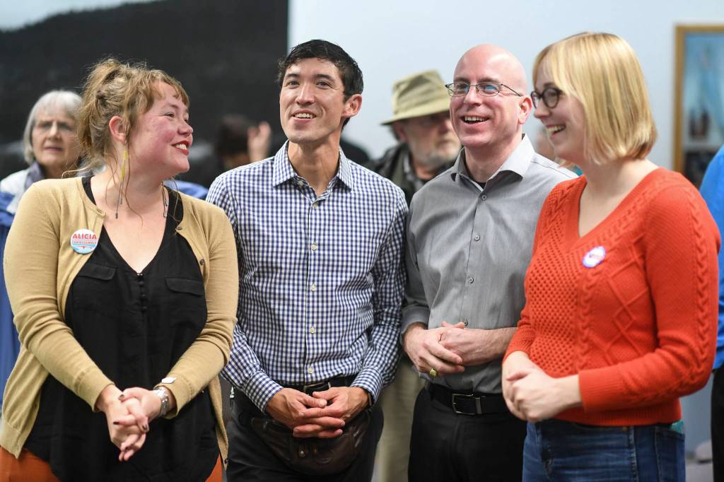 Alicia Hughes-Skandijs, left, Greg Smith, Wade Bryson and Carole Triem watch results come in at City Hall on Tuesday, Oct. 1, 2019. (Michael Penn | Juneau Empire)
