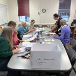 City staff aided by volunteers verify absentee and other irregular ballots on Friday, Oct. 4, 2019. (Peter Segall | Juneau Empire)