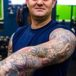 Machinery Technician 2nd Class Anthony Delorenzo, Coast Guardsman stationed at Coast Guard Station Juneau, displays his tattoos Oct. 4, 2019. (Michael S. Lockett | Juneau Empire)