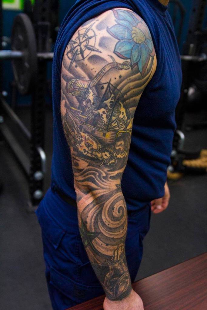 Machinery Technician 2nd Class Anthony Delorenzo, Coast Guardsman stationed at Coast Guard Station Juneau, displays his tattoos Oct. 4, 2019. (Michael S. Lockett | Juneau Empire)