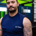 Boatswains Mate 2nd Class Jesse Dyals, Coast Guardsman stationed at Coast Guard Station Juneau, displays his tattoos Oct. 4, 2019. (Michael S. Lockett | Juneau Empire)