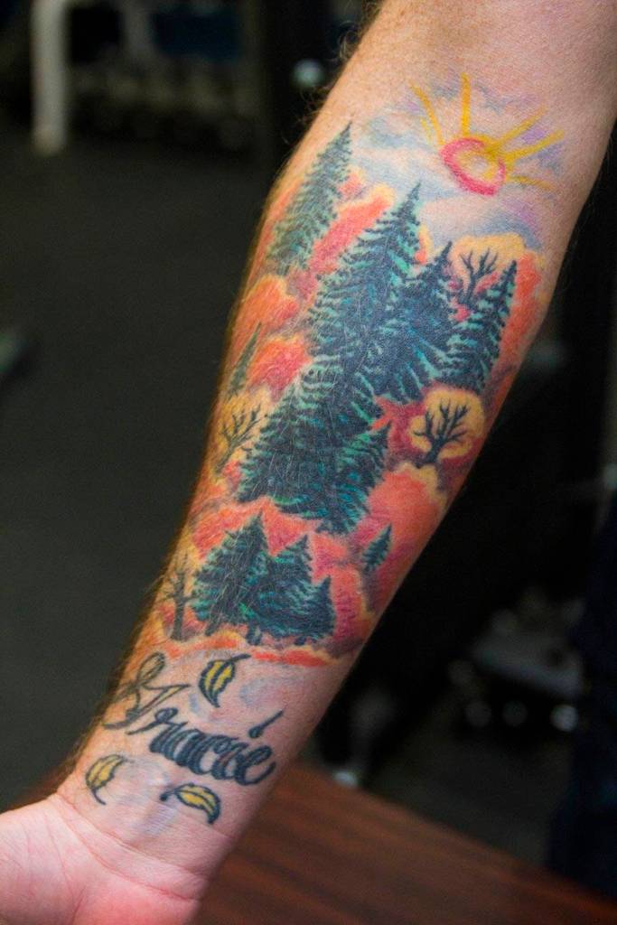 Boatswains Mate 1st Class Trevor Shirley, Coast Guardsman stationed at Coast Guard Station Juneau, displays his tattoos Oct. 4, 2019. (Michael S. Lockett | Juneau Empire)