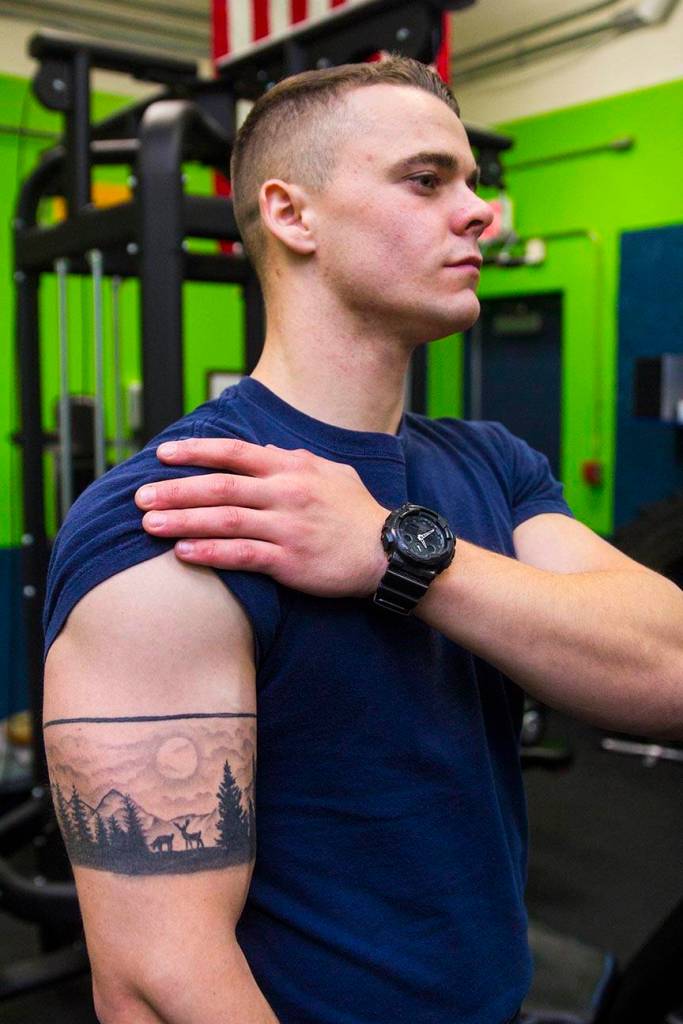Boatswains Mate 3rd Class Camden Marshall, Coast Guardsman stationed at Coast Guard Station Juneau, displays his tattoos Oct. 4, 2019. (Michael S. Lockett | Juneau Empire)